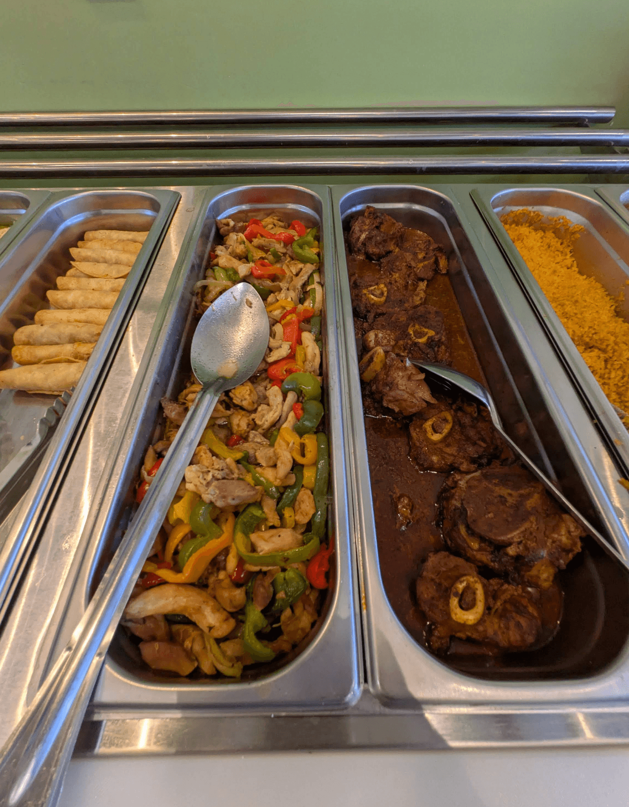 Weekend breakfast buffet trays with fajita mix, mole oxtail and Spanish rice at Roberta's Cocina Mexicana Sacramento