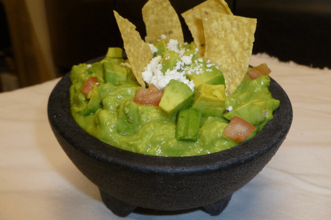 House-made guacamole served in a molcajete with tortilla chips and queso fresco at Roberta's Cocina Mexicana Sacramento