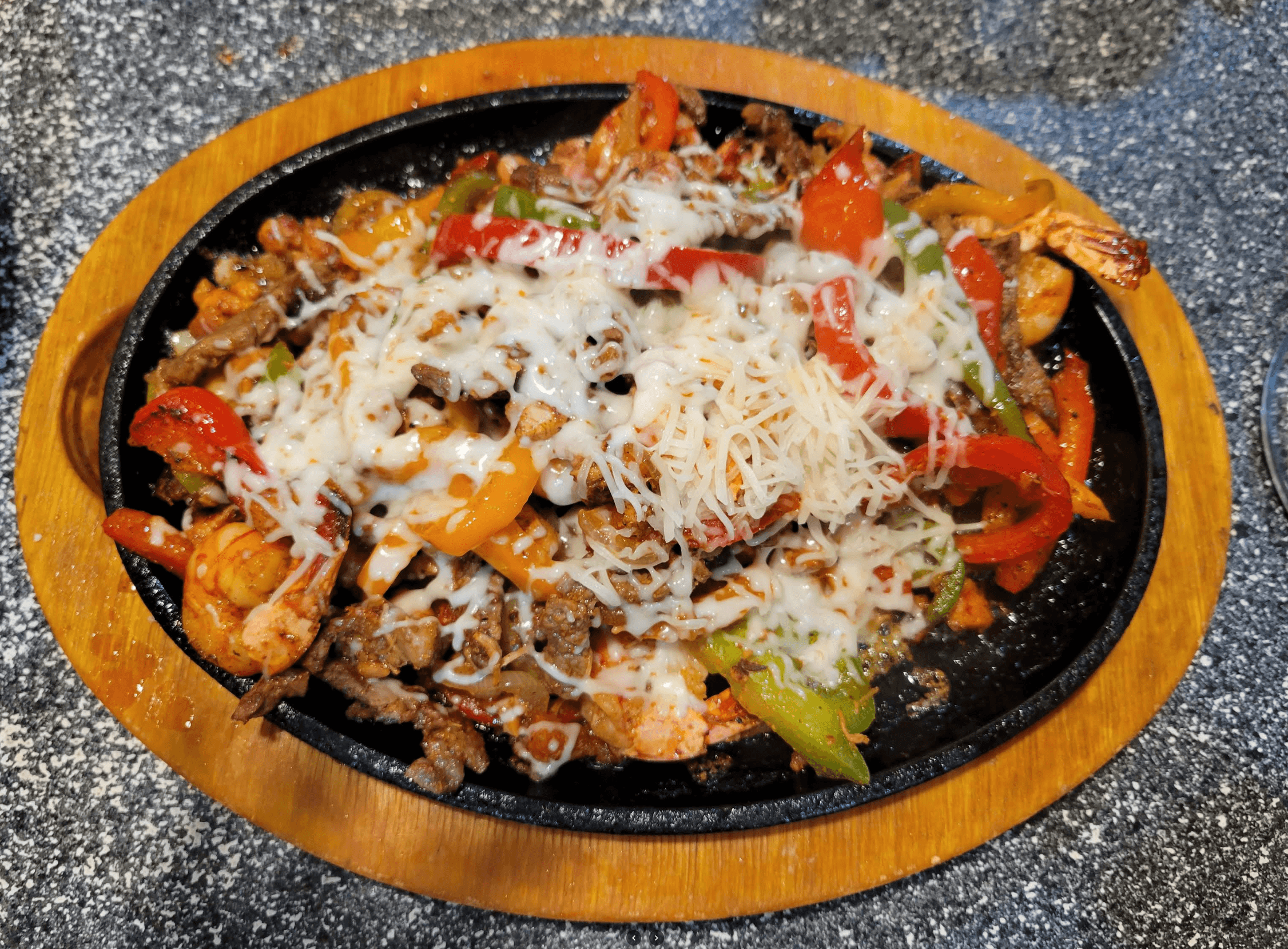 Sizzling mixed fajitas with shrimp, steak and colorful bell peppers at Roberta's Cocina Mexicana Sacramento