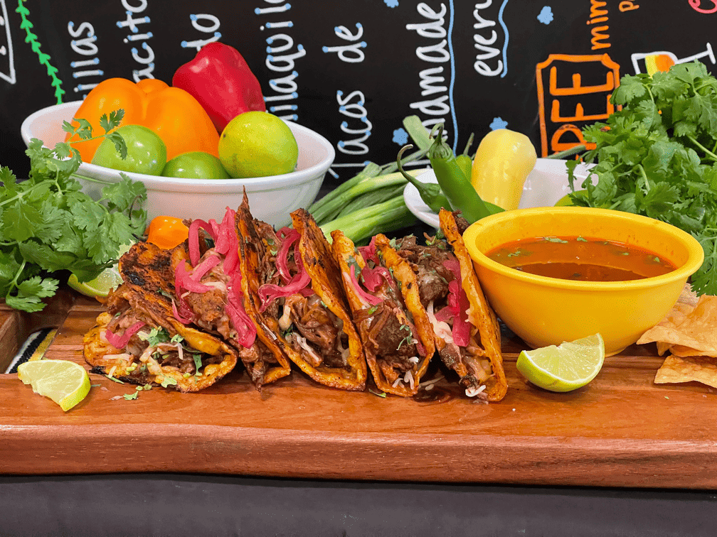 Quesabirria tacos with consommé and fresh vegetables at Roberta's Cocina Mexicana Sacramento